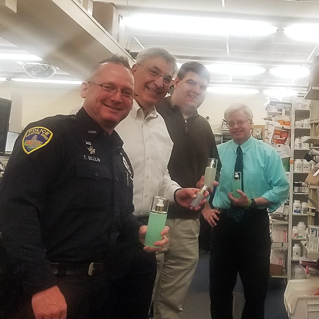 Davies Pharmacy donating hand sanitizer to the Canton Police Department