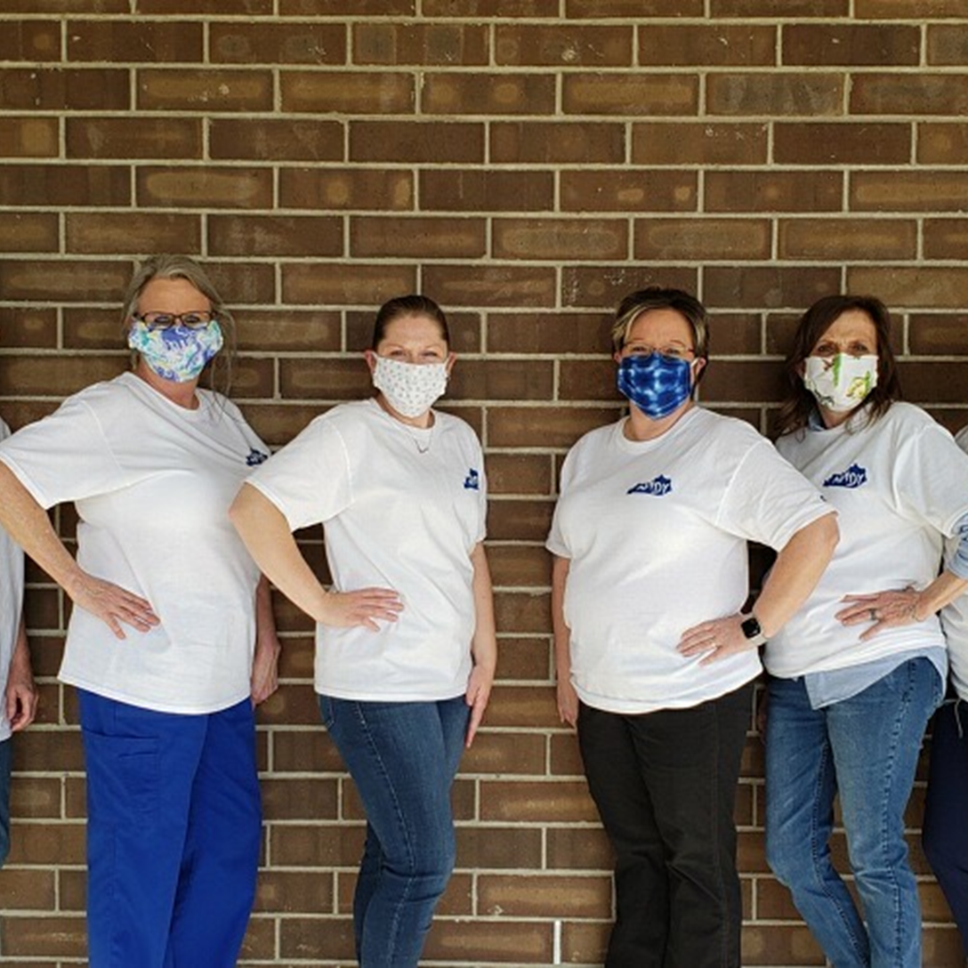 The team at Glenn's Apothecary wearing homemade face masks