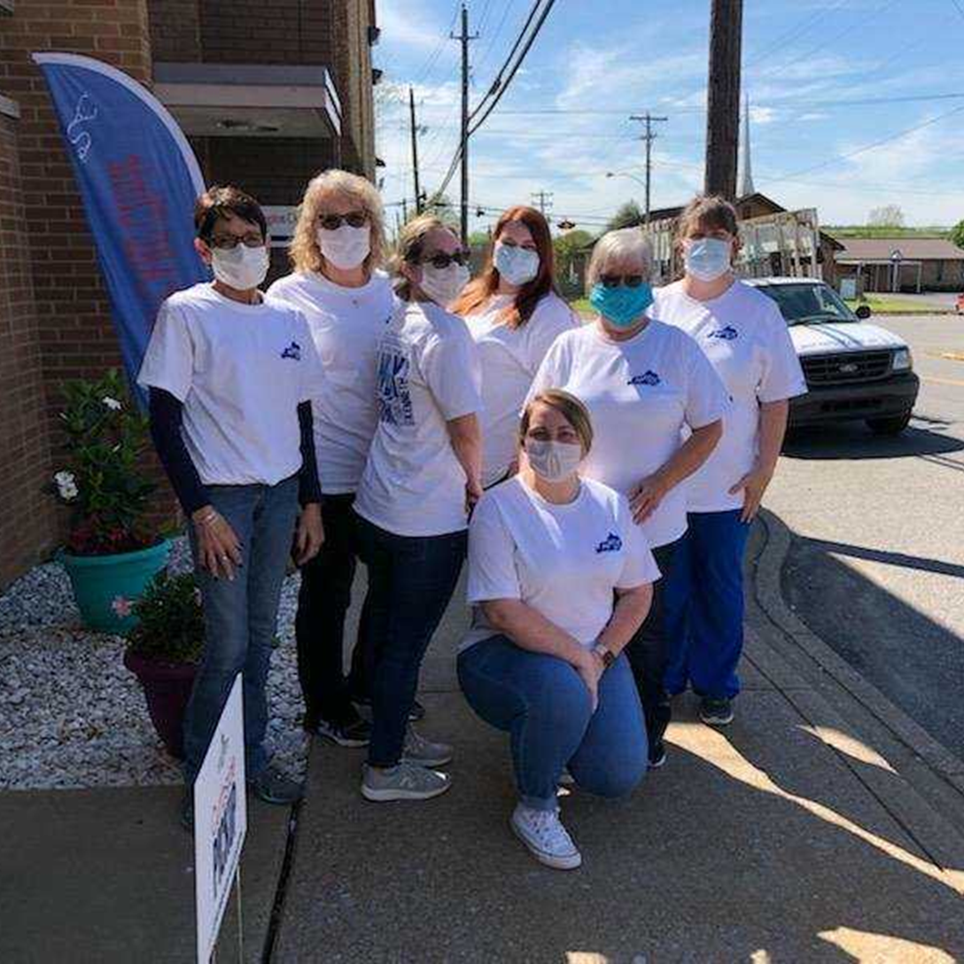 The team at Glenn's Prescription Center wearing homemade face masks