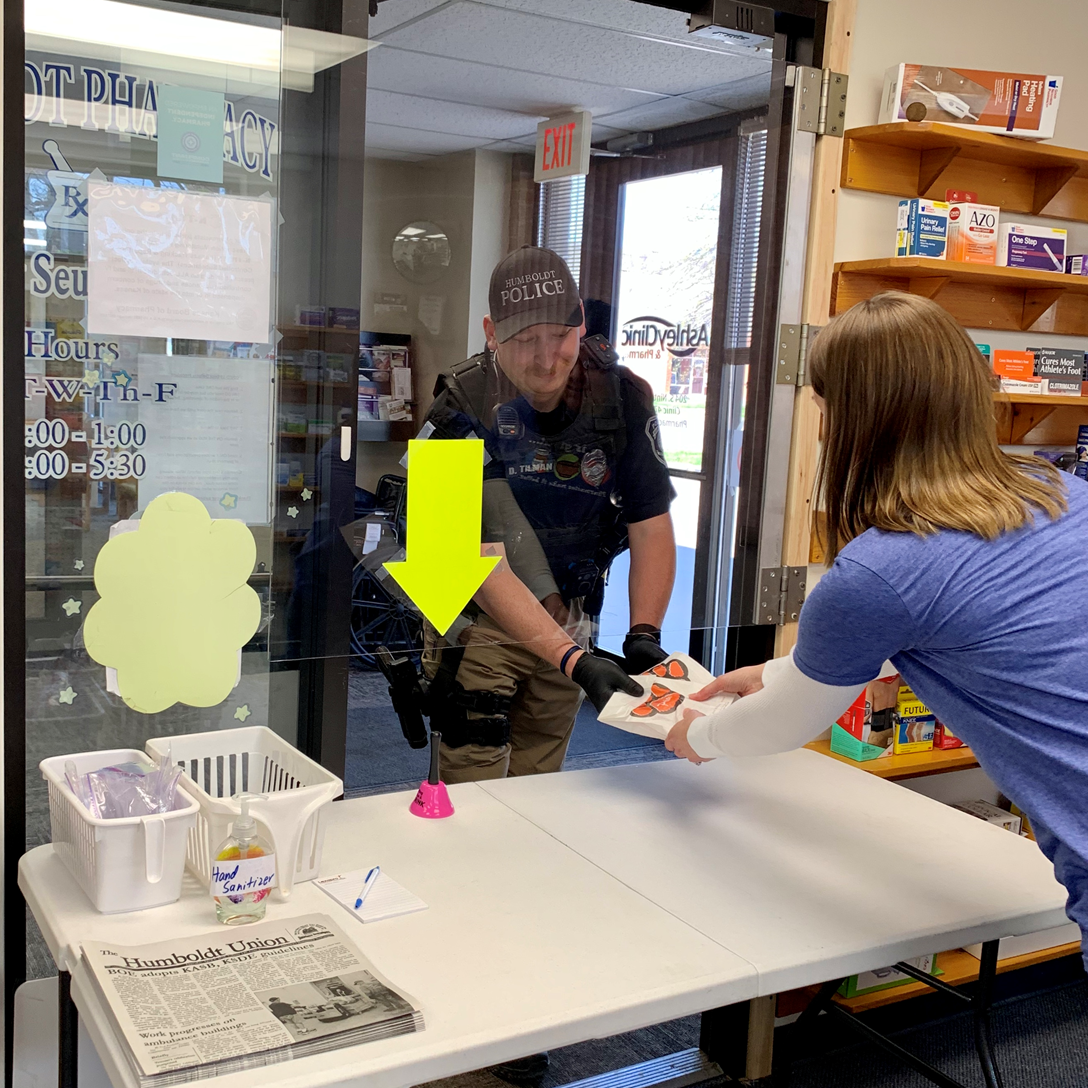 Hummboldt Pharmacy donating hand sanitizer to their local police department
