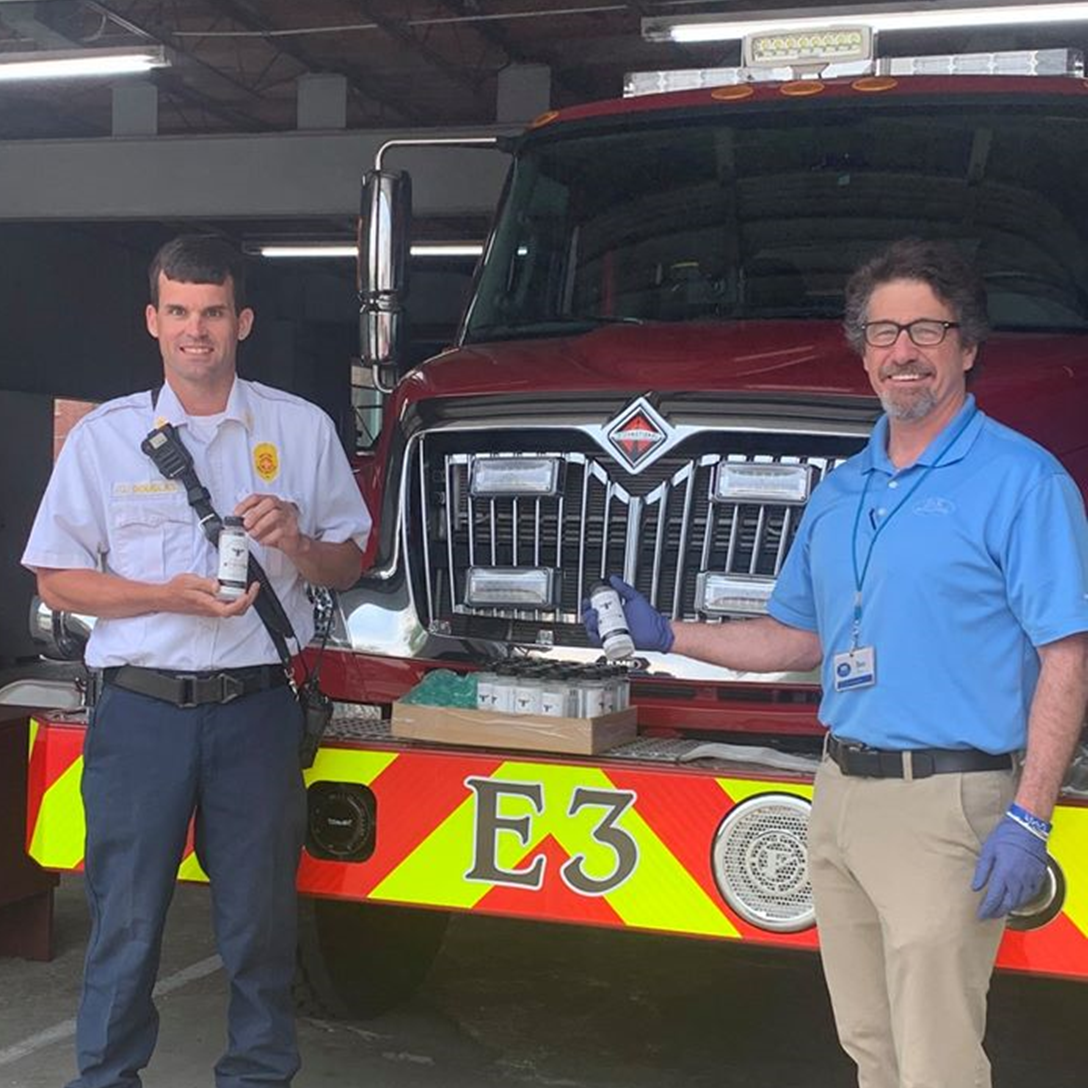 IHS Pharmacy & Gifts delivers hand sanitizer to their local fire department