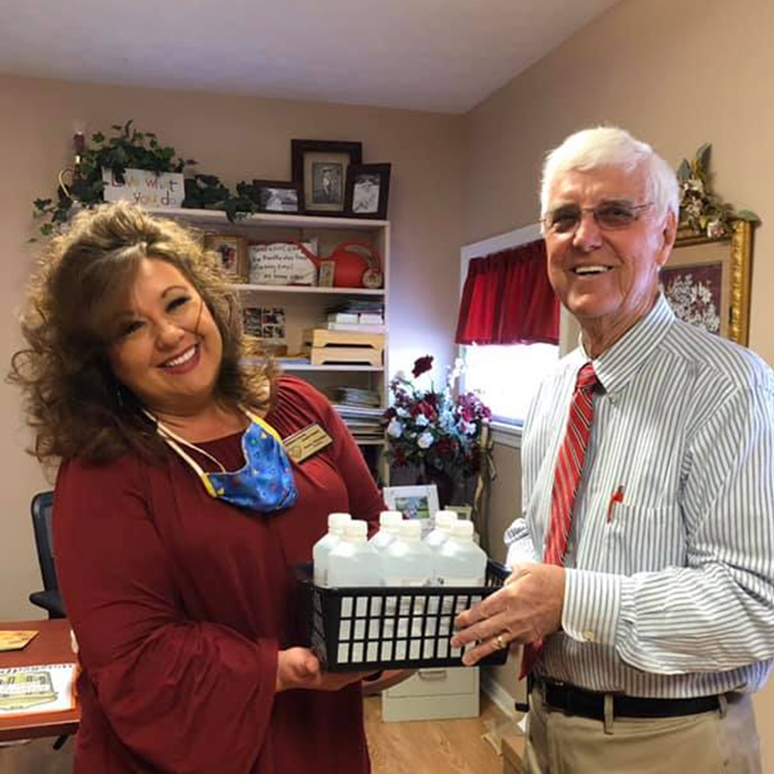 Mountain City Pharmacy donating hand sanitizer to their local senior center