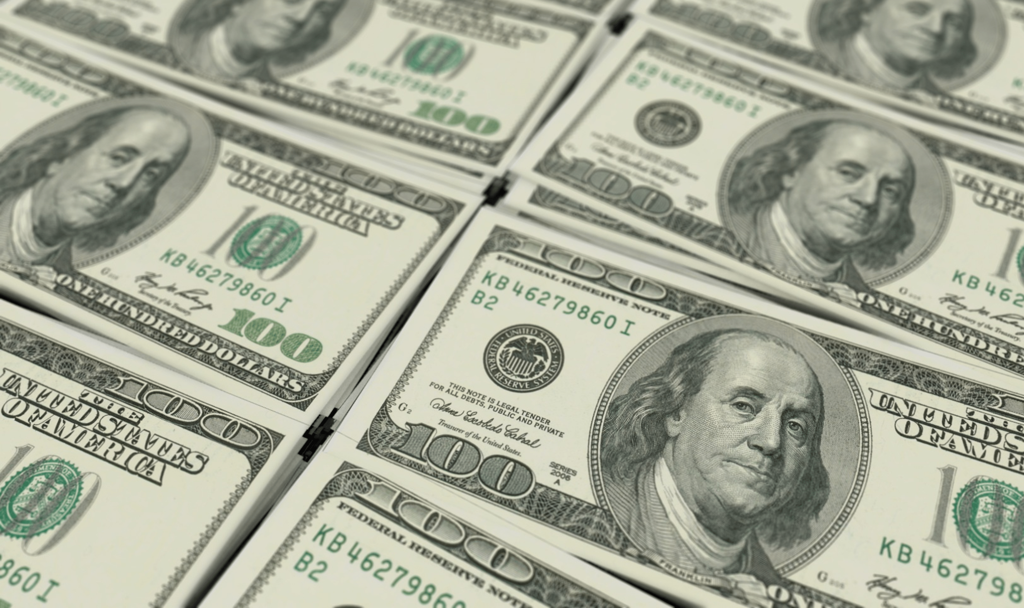 Stacks of hundred dollar bills