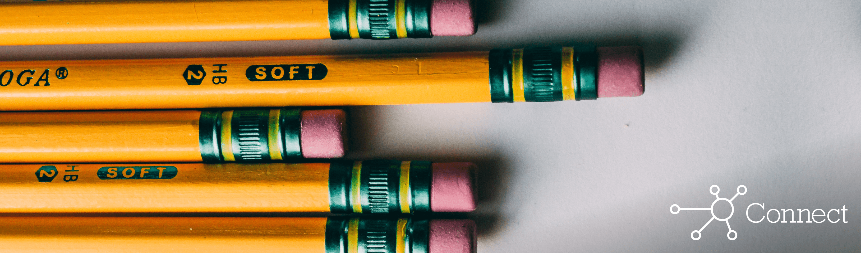 Five pencils lined up side by side