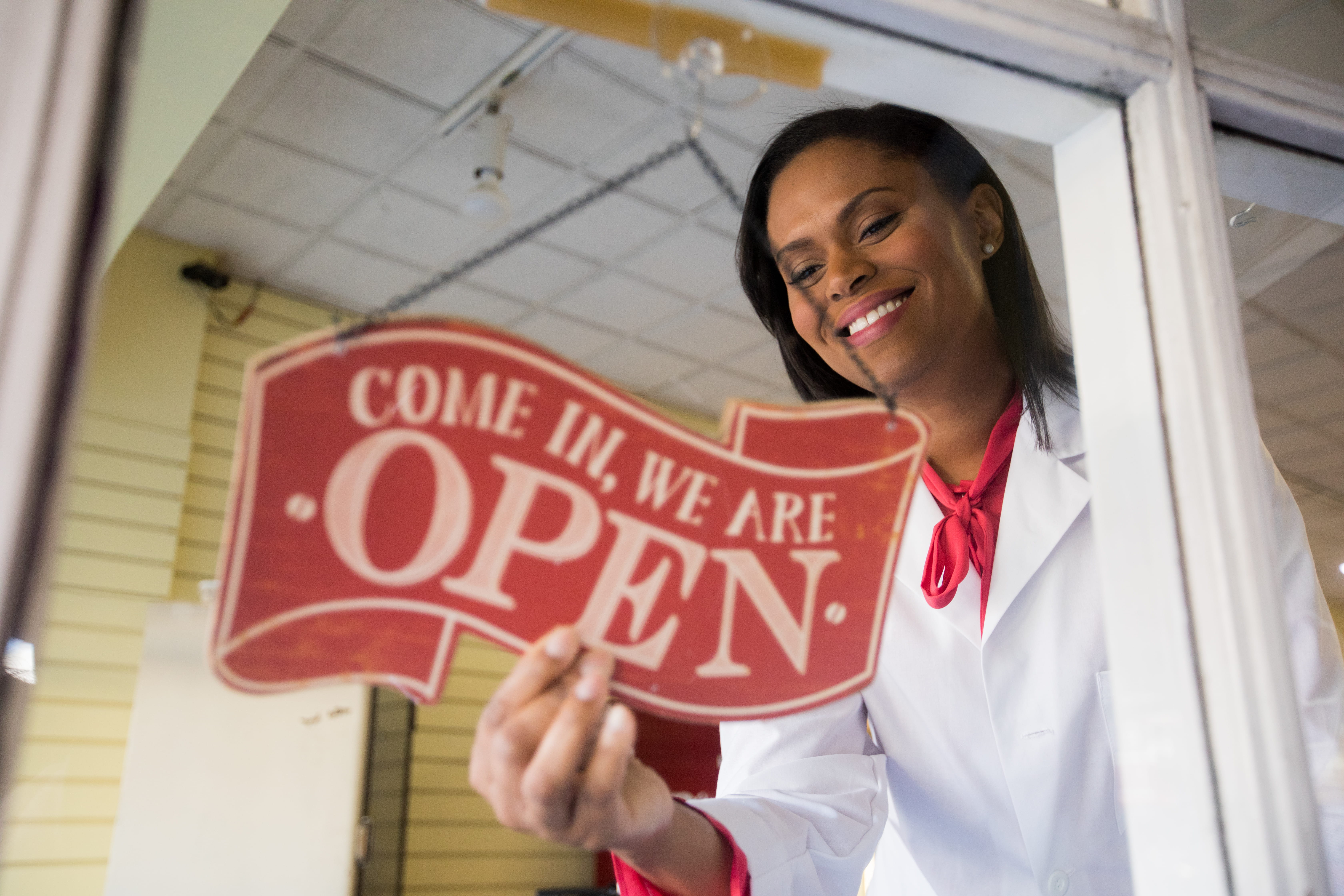 A pharmacist opens up her new pharmacy
