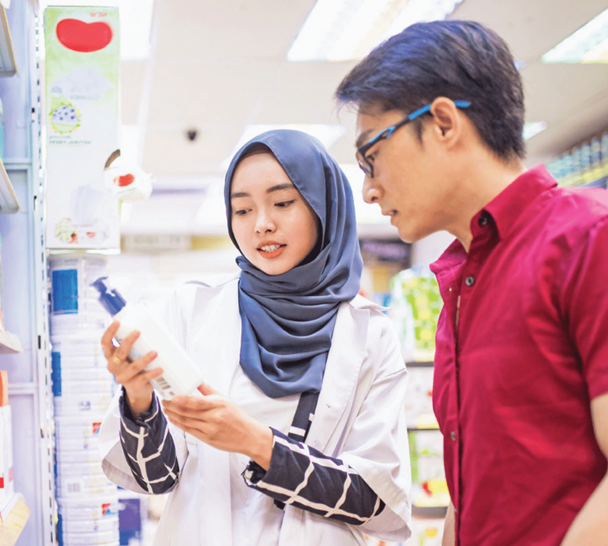 A pharmacist helping a patient select an over-the-counter item