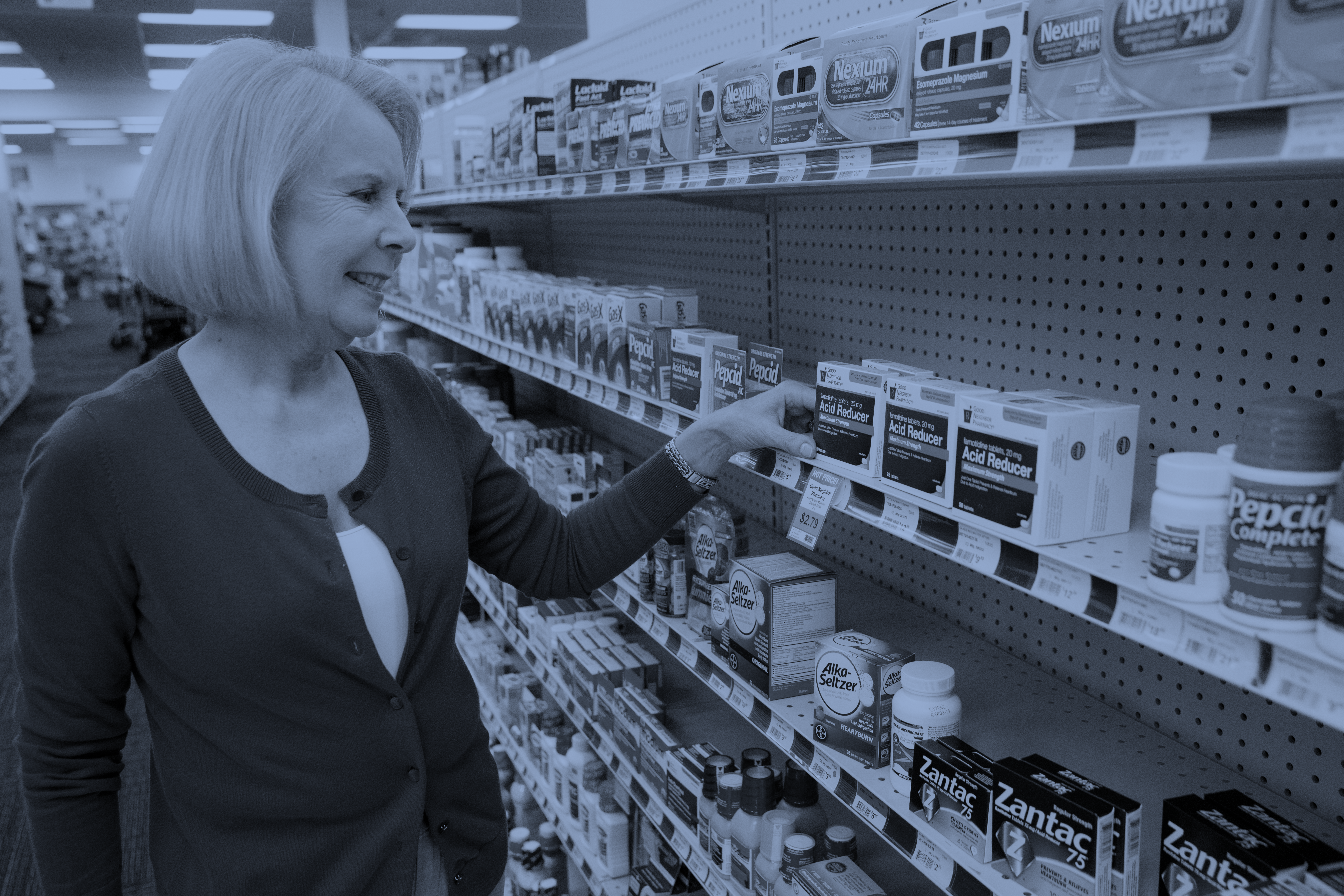 A customer enjoys a positive in-store experience while shopping at a pharmacy