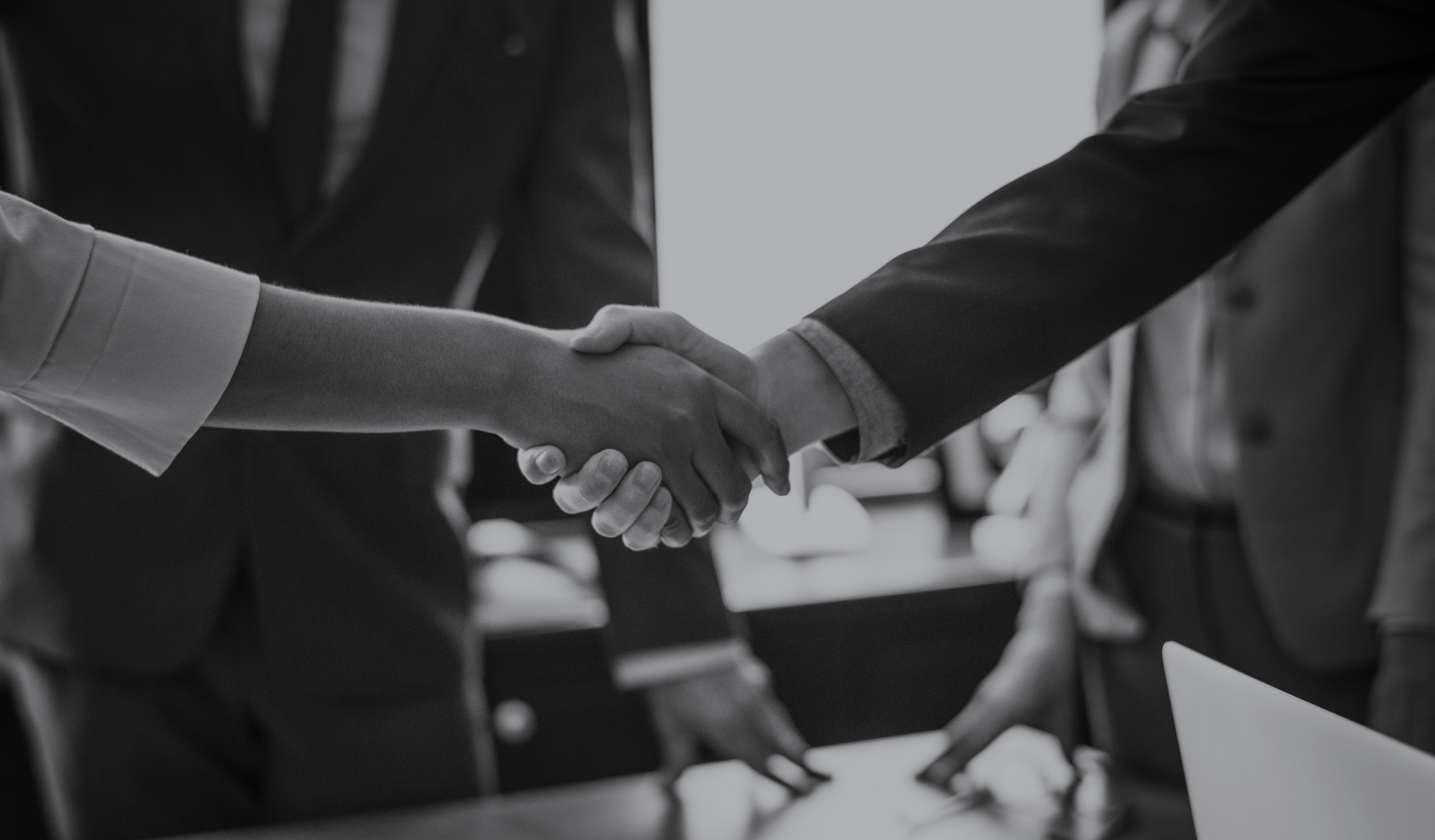 Business people shake hands over successful strategic contracting