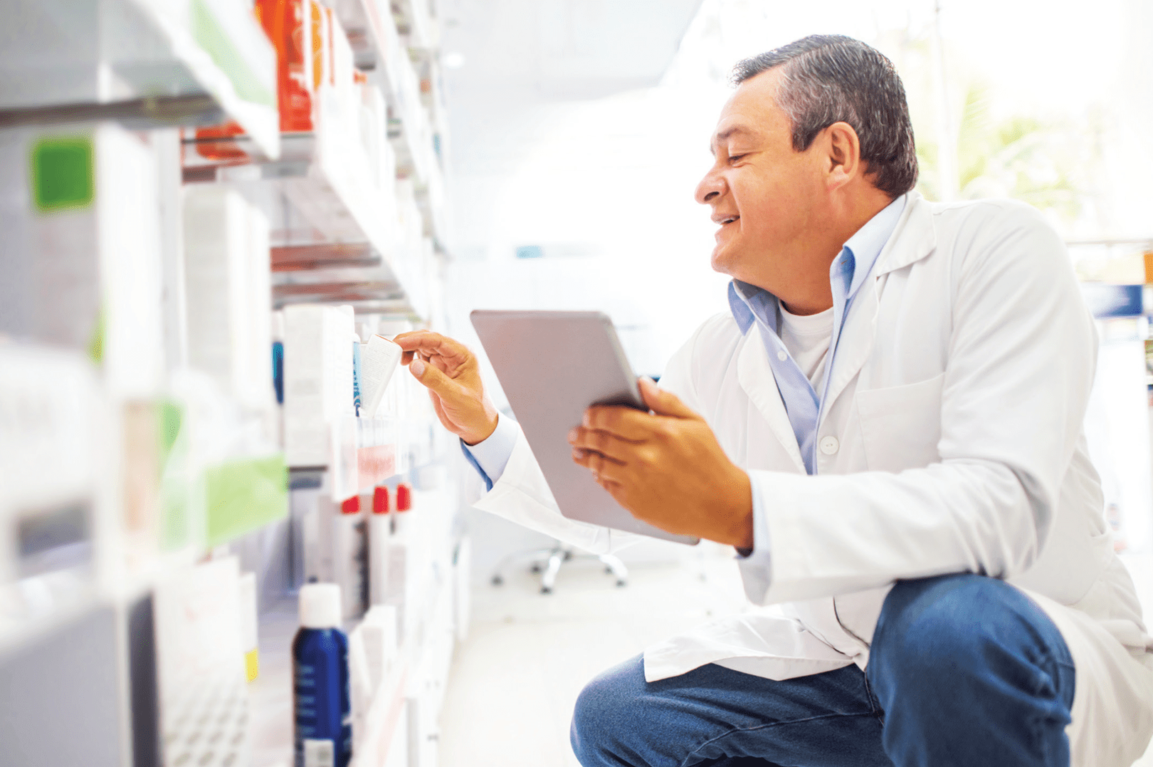 An independent pharmacist managing his front-end inventory