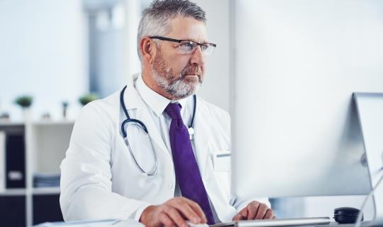 Doctor on computer